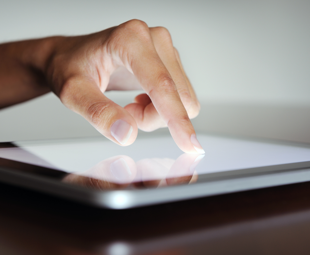 hand touching a tablet