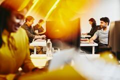 man and women working in an office