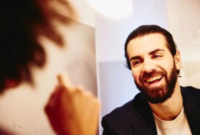 Close up - Smiling man looking at someone.