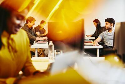 man and women working in an office