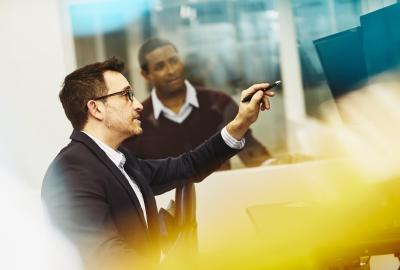 Two men working together in an office