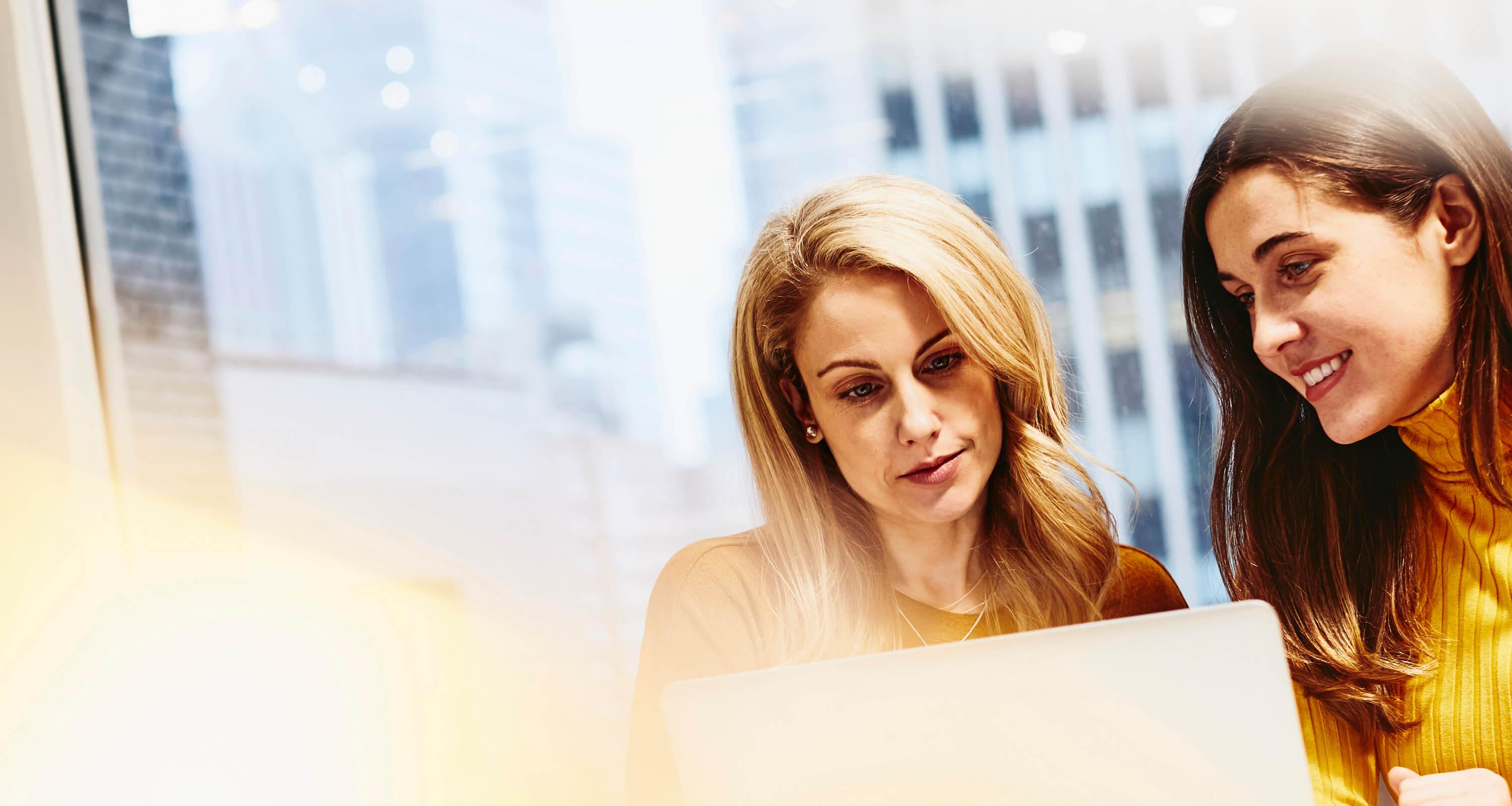 two women working together 